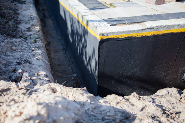Professional Waterproofing technician working in Odon, IN
